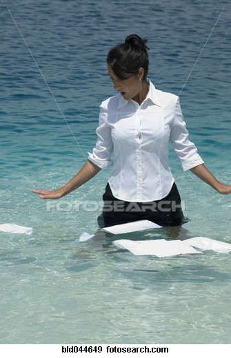  MISHAPS - Hispanic businesswoman with papers in water.jpg
